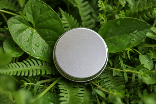 lip balm tin, no logo or label, greenery background